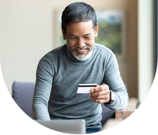 man with computer and credit card