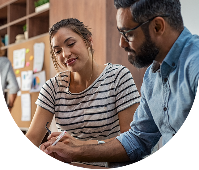 Business owner and employee doing paperwork