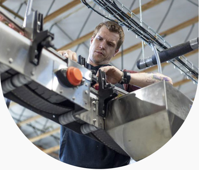Industrial worker diagnoses machinery