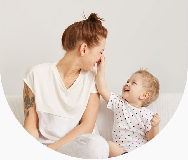 Mom and baby smiling