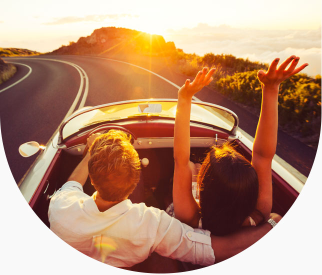 People in car at sunset