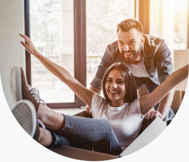 Young couple smiling in their home