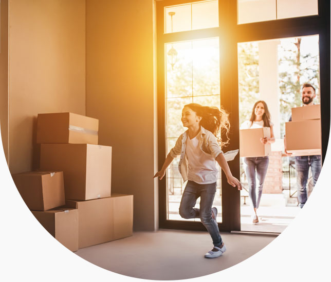 family in new house with boxes