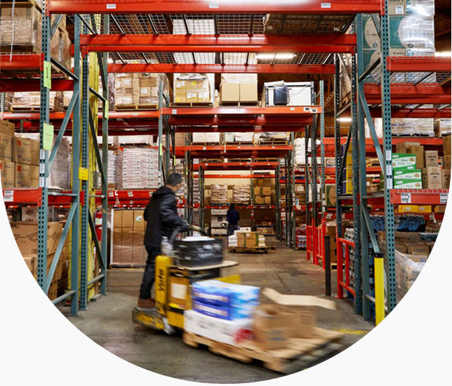 Warehouse worker operates machine