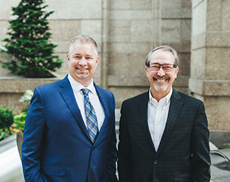 Two smiling Umpqua commercial bankers
