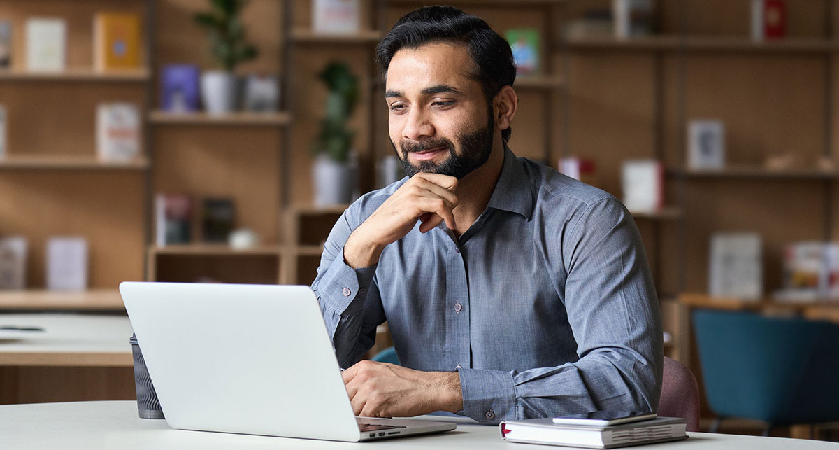 Man looking at computer in office