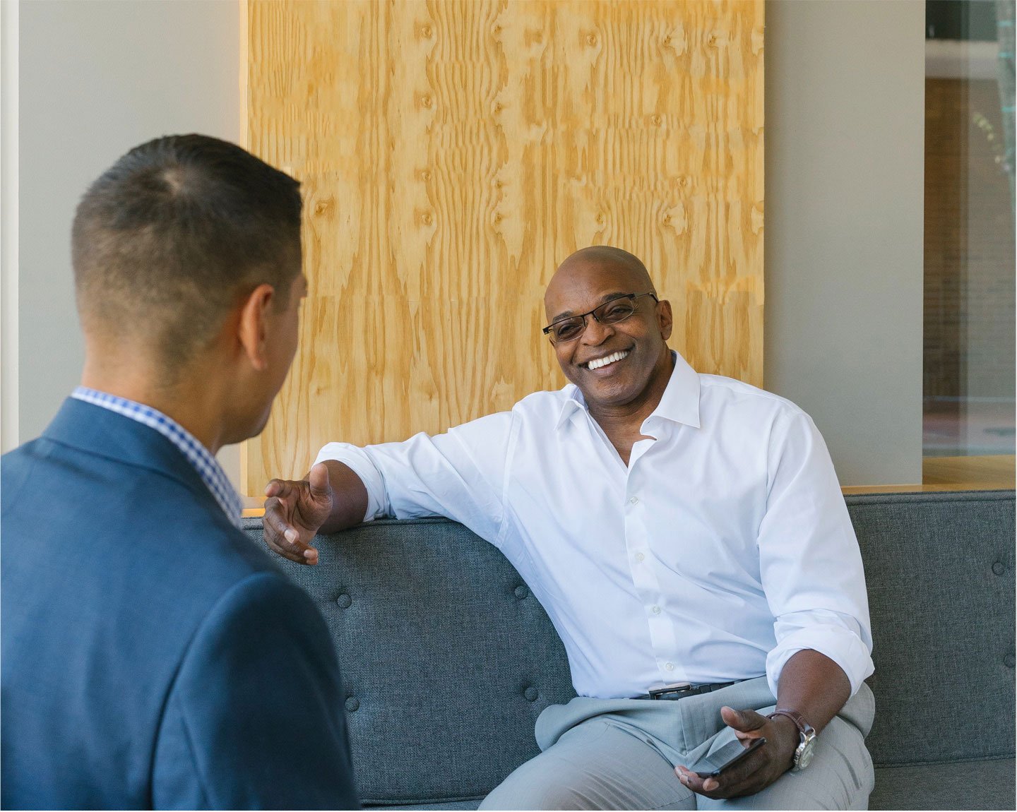 Banker talks with customer in relaxed environment