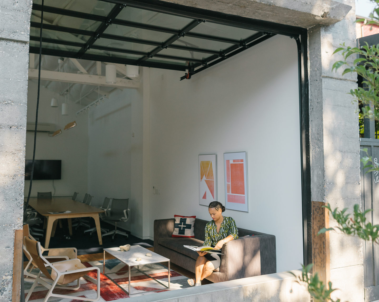 Person reads book in casual workspace