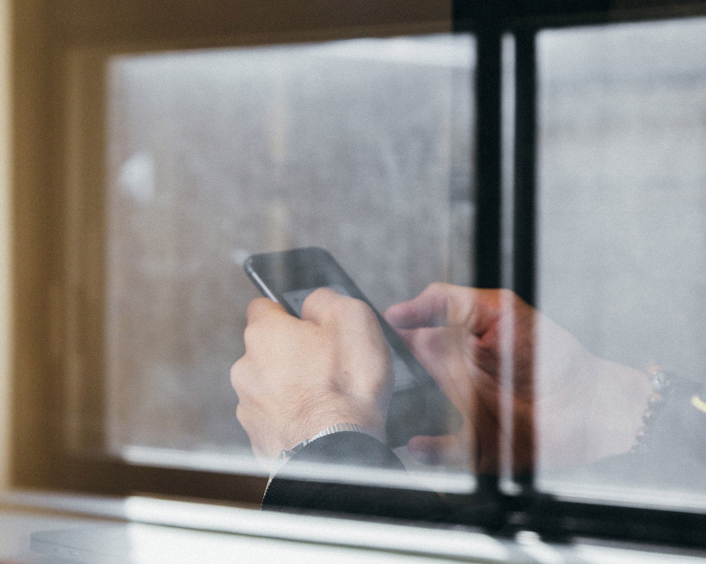 Close up of hands holding a mobile phone